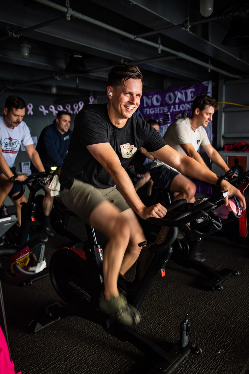 USS Ronald Reagan (CVN 76) Sailors participate in a Cycle-to-End-the-Cycle challenge