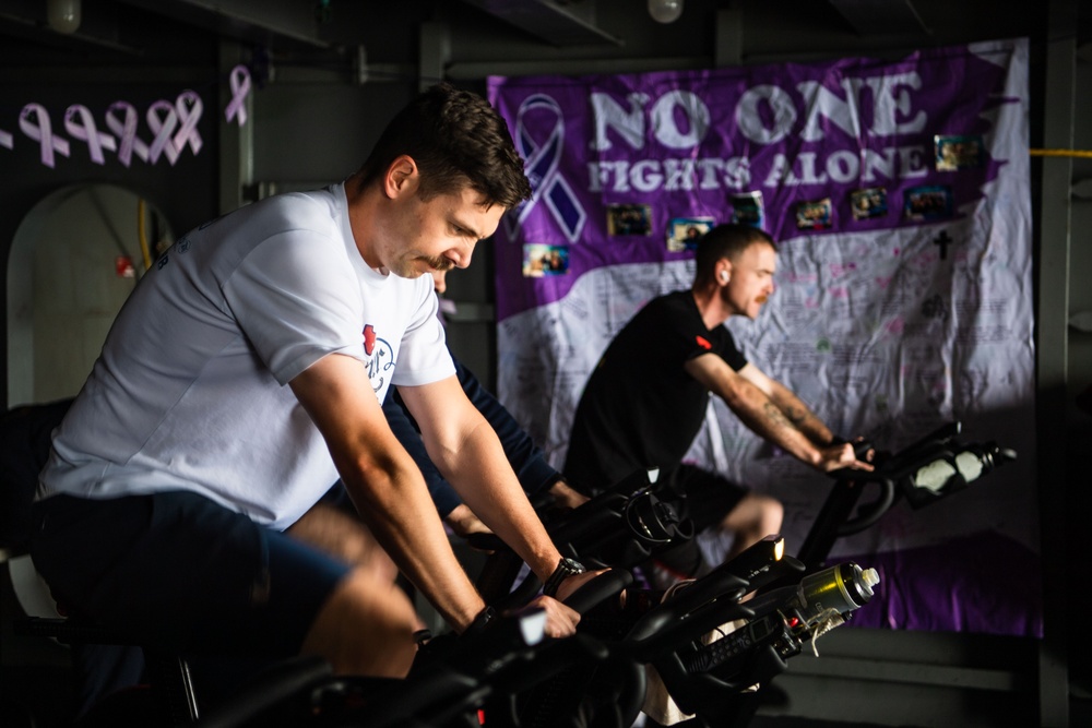 USS Ronald Reagan (CVN 76) Sailors participate in a Cycle-to-End-the-Cycle challenge