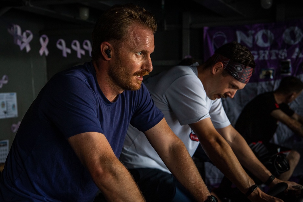 USS Ronald Reagan (CVN 76) Sailors participate in a Cycle-to-End-the-Cycle challenge