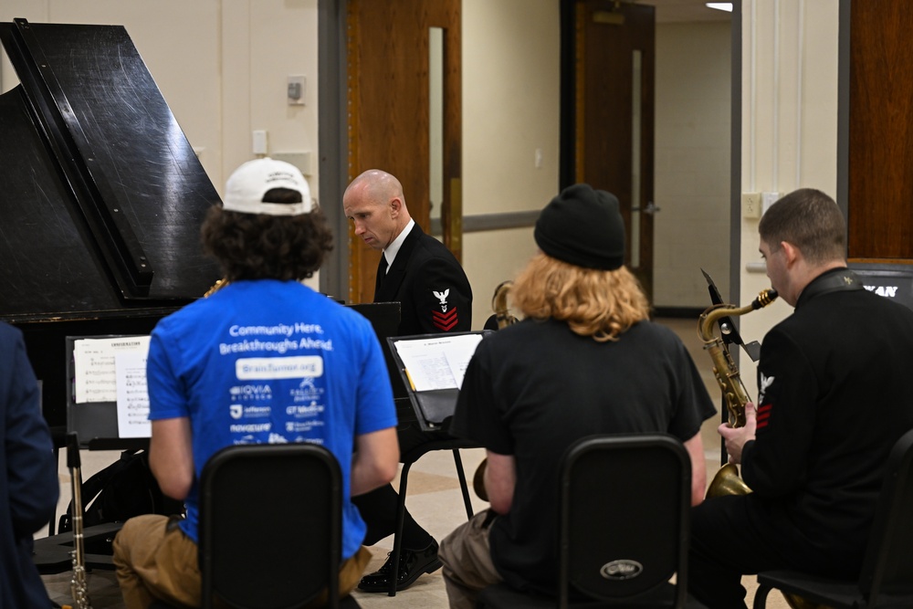 Members of the U.S. Navy Band Commodores perform alongside Rowan University students