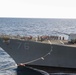 USS George Washington (CVN 73) conducts a fueling-at-sea with USS Higgins (DDG 76)