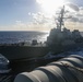 USS George Washington (CVN 73) conducts a fueling-at-sea with USS Higgins (DDG 76)