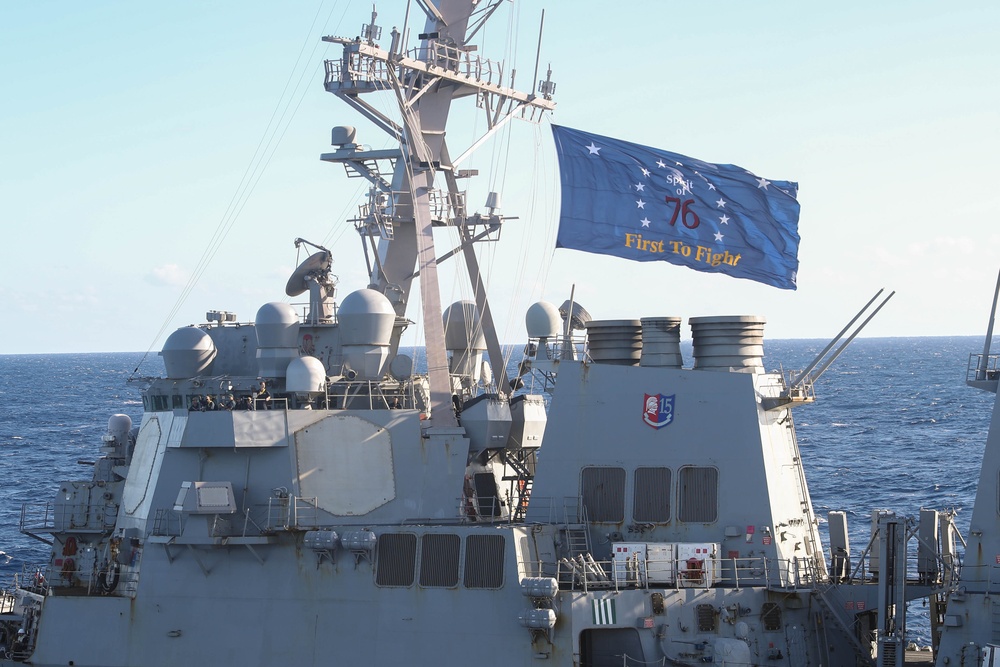 USS George Washington (CVN 73) conducts a fueling-at-sea with USS Higgins (DDG 76)