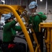 Nimitz Sailors Perform Maintenance on a Forklift