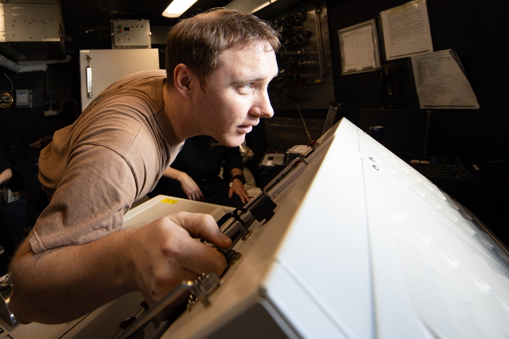 AIMD Sailors prepare and test jet engine aboard USS George Washington