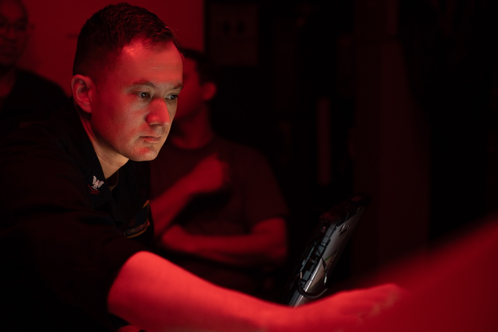 AIMD Sailors prepare and test jet engine aboard USS George Washington