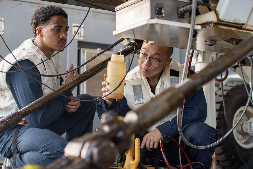 AIMD Sailors prepare and test jet engine aboard USS George Washington