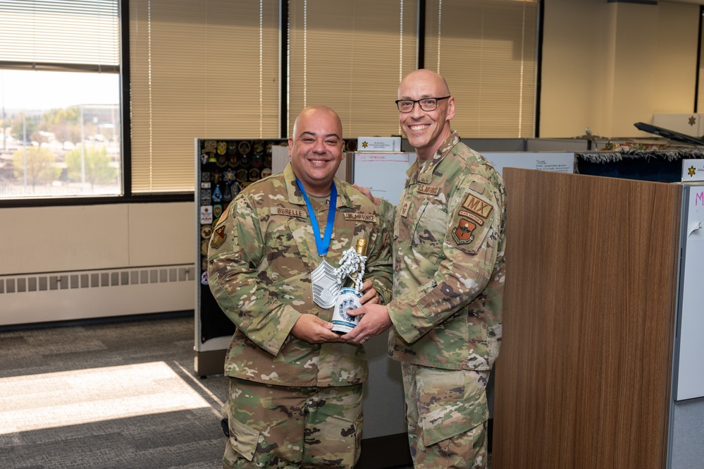 Chief Master Sgt. Select Christopher Burelle, Air Force Inspection Agency Nuclear Inspections superintendent, poses with Chief Master Sergeant Jessie Thomas