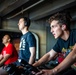 USS Ronald Reagan (CVN 76) Sailors participate in a Cycle-to-End-the-Cycle challenge