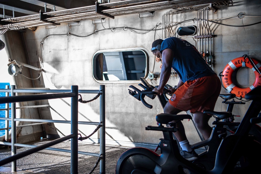 USS Ronald Reagan (CVN 76) Sailors participate in a Cycle-to-End-the-Cycle challenge