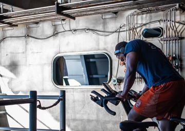 USS Ronald Reagan (CVN 76) Sailors participate in a Cycle-to-End-the-Cycle challenge