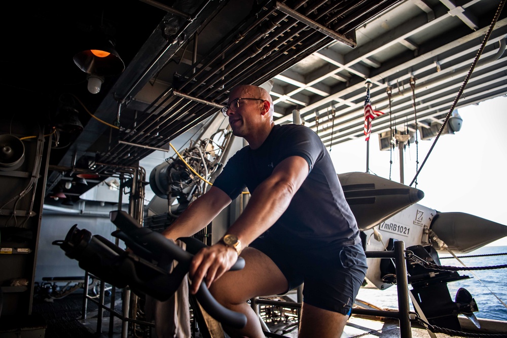 USS Ronald Reagan (CVN 76) Sailors participate in a Cycle-to-End-the-Cycle challenge