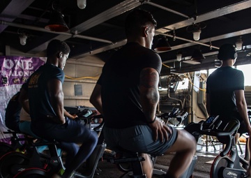 USS Ronald Reagan (CVN 76) Sailors participate in a Cycle-to-End-the-Cycle challenge