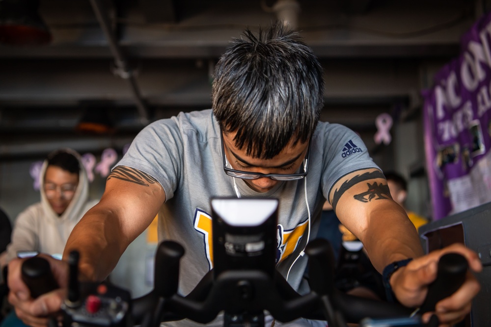 USS Ronald Reagan (CVN 76) Sailors participate in a Cycle-to-End-the-Cycle challenge