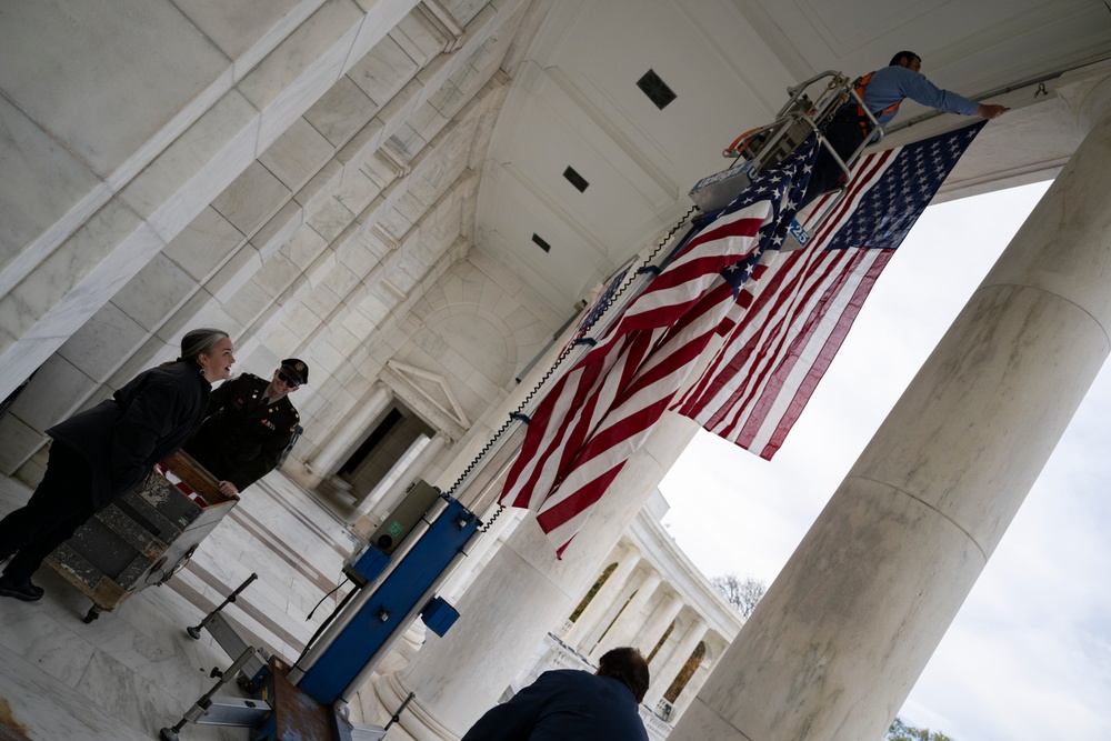 U.S. Flags are Hung in the Memorial Amphitheater in Preparation for the 2024 National Veterans Day Observance