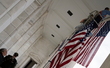 U.S. Flags are Hung in the Memorial Amphitheater in Preparation for the 2024 National Veterans Day Observance