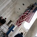 U.S. Flags are Hung in the Memorial Amphitheater in Preparation for the 2024 National Veterans Day Observance