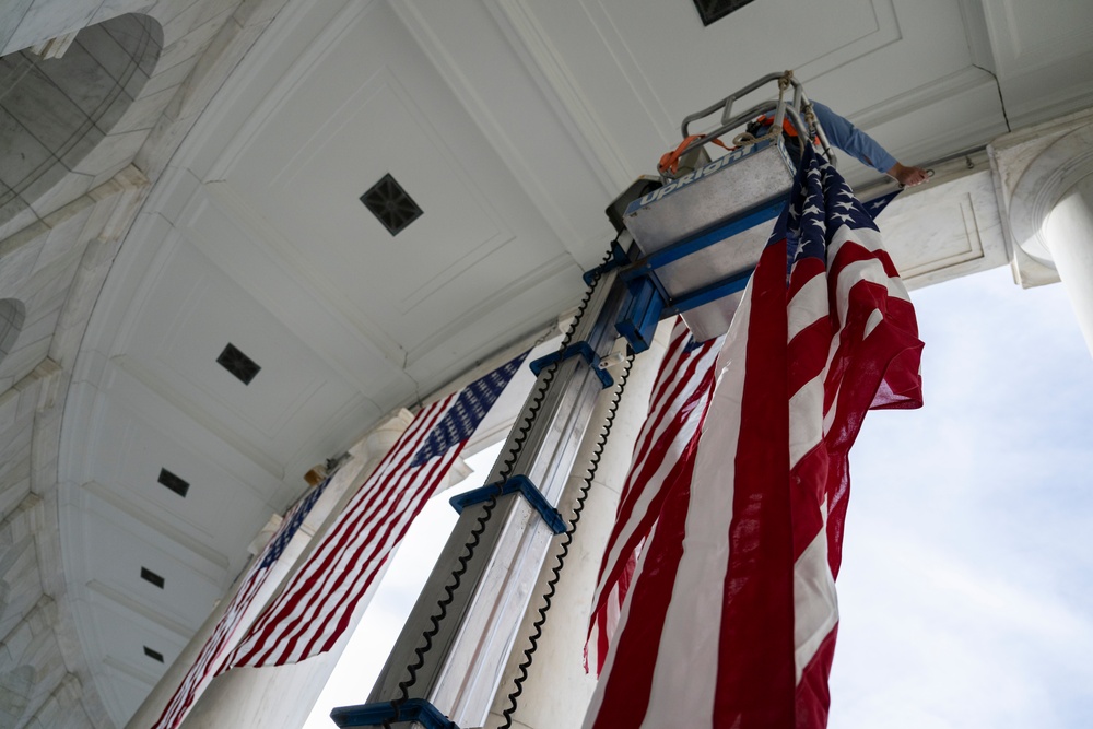 U.S. Flags are Hung in the Memorial Amphitheater in Preparation for the 2024 National Veterans Day Observance