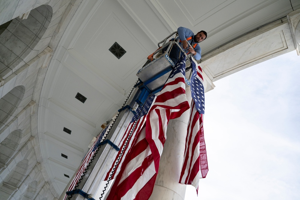 U.S. Flags are Hung in the Memorial Amphitheater in Preparation for the 2024 National Veterans Day Observance