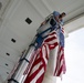 U.S. Flags are Hung in the Memorial Amphitheater in Preparation for the 2024 National Veterans Day Observance