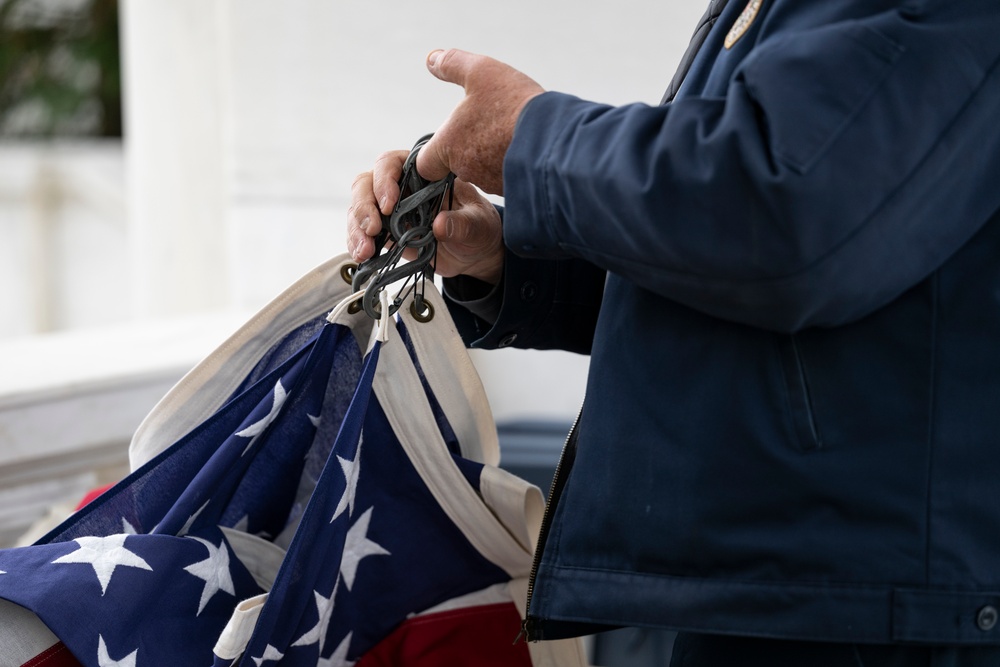 U.S. Flags are Hung in the Memorial Amphitheater in Preparation for the 2024 National Veterans Day Observance