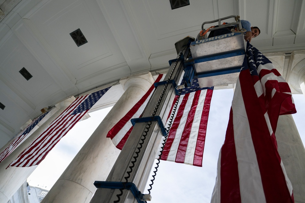 U.S. Flags are Hung in the Memorial Amphitheater in Preparation for the 2024 National Veterans Day Observance