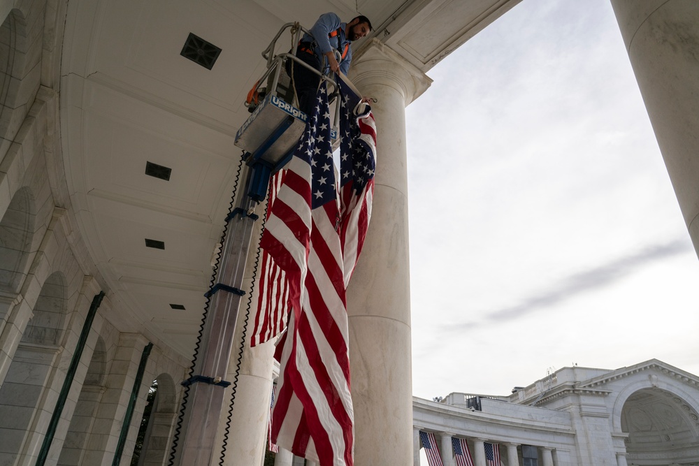 U.S. Flags are Hung in the Memorial Amphitheater in Preparation for the 2024 National Veterans Day Observance