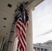 U.S. Flags are Hung in the Memorial Amphitheater in Preparation for the 2024 National Veterans Day Observance