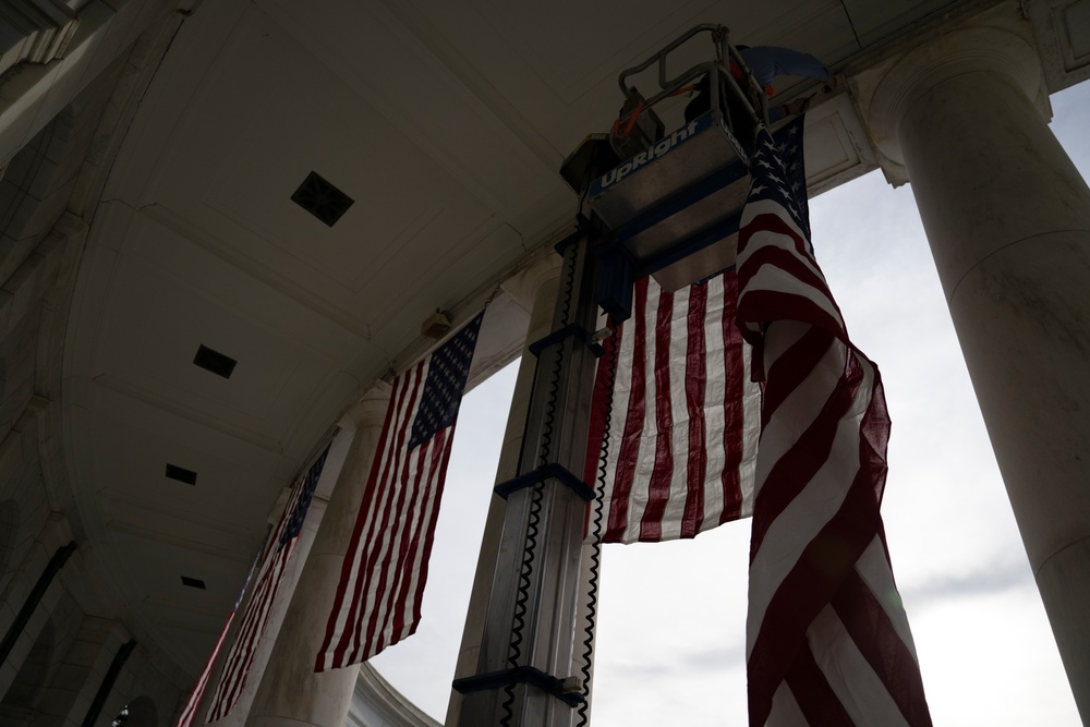 U.S. Flags are Hung in the Memorial Amphitheater in Preparation for the 2024 National Veterans Day Observance