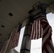 U.S. Flags are Hung in the Memorial Amphitheater in Preparation for the 2024 National Veterans Day Observance