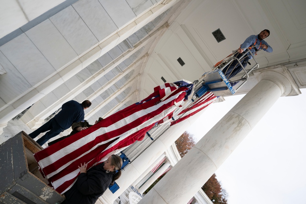 U.S. Flags are Hung in the Memorial Amphitheater in Preparation for the 2024 National Veterans Day Observance