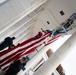 U.S. Flags are Hung in the Memorial Amphitheater in Preparation for the 2024 National Veterans Day Observance