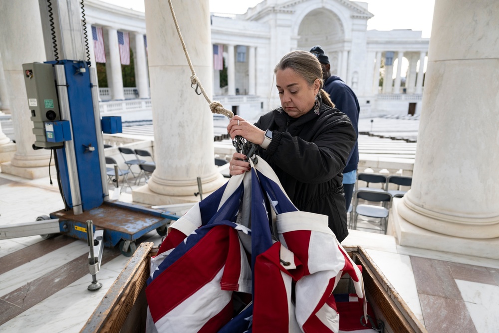 U.S. Flags are Hung in the Memorial Amphitheater in Preparation for the 2024 National Veterans Day Observance