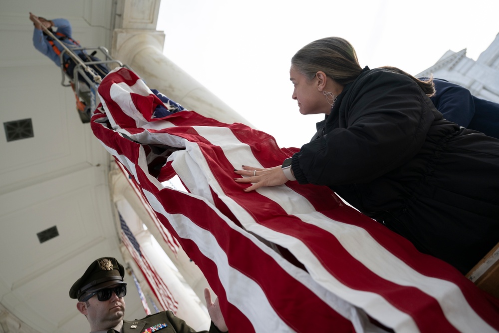 U.S. Flags are Hung in the Memorial Amphitheater in Preparation for the 2024 National Veterans Day Observance