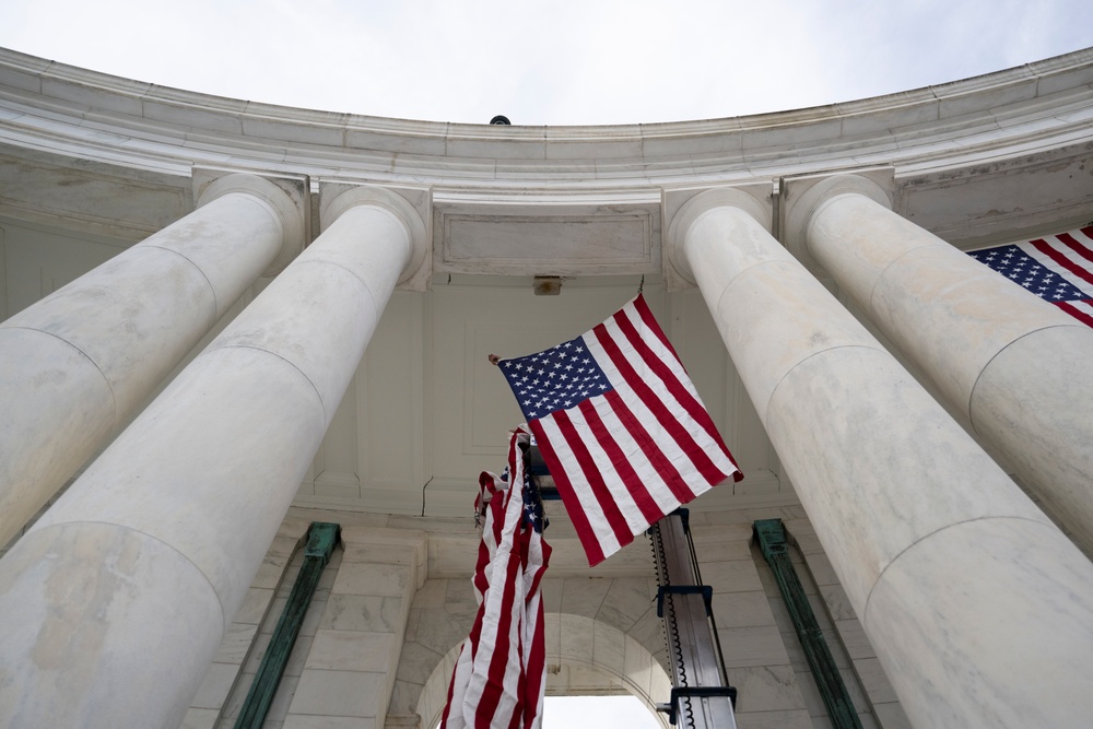 U.S. Flags are Hung in the Memorial Amphitheater in Preparation for the 2024 National Veterans Day Observance