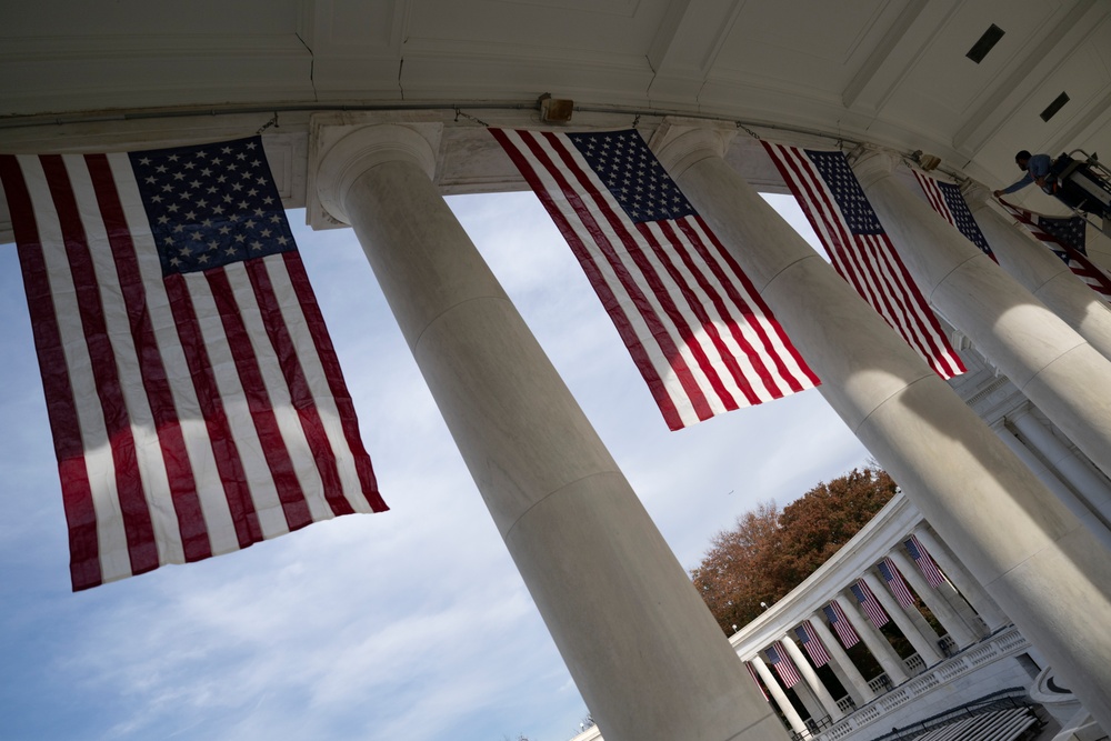 U.S. Flags are Hung in the Memorial Amphitheater in Preparation for the 2024 National Veterans Day Observance