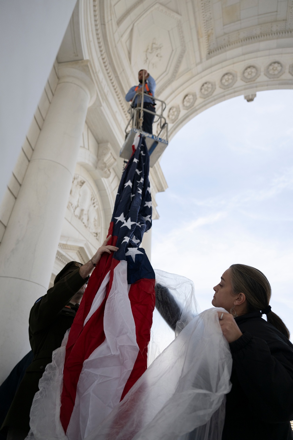 U.S. Flags are Hung in the Memorial Amphitheater in Preparation for the 2024 National Veterans Day Observance