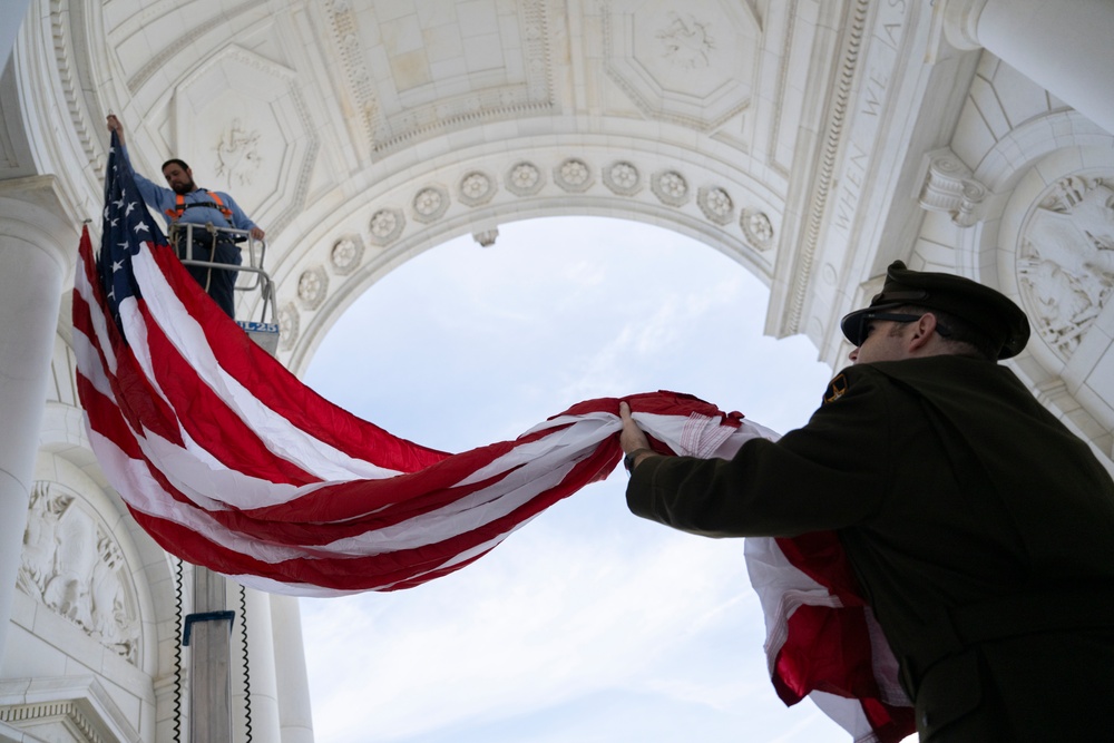 U.S. Flags are Hung in the Memorial Amphitheater in Preparation for the 2024 National Veterans Day Observance