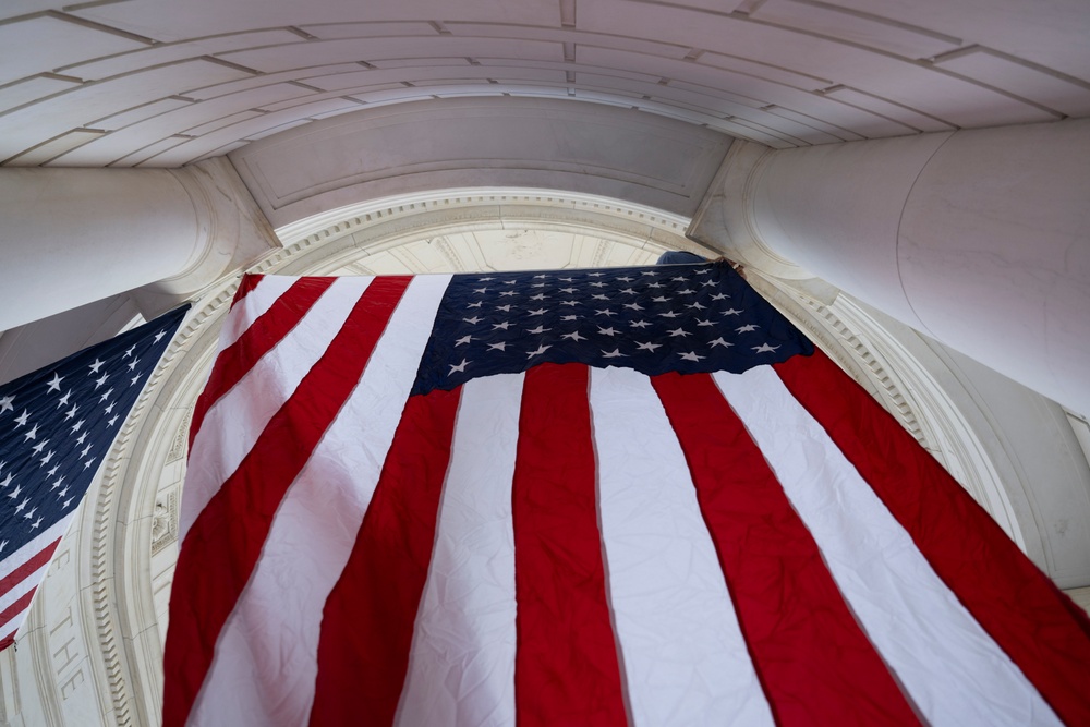 U.S. Flags are Hung in the Memorial Amphitheater in Preparation for the 2024 National Veterans Day Observance