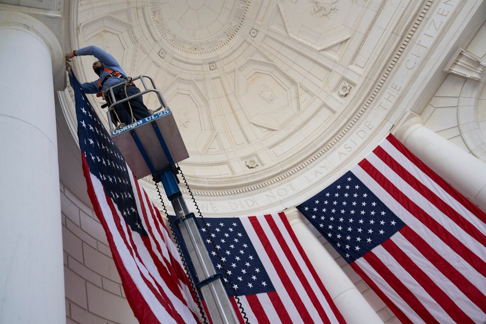 U.S. Flags are Hung in the Memorial Amphitheater in Preparation for the 2024 National Veterans Day Observance