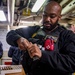 Nimitz Sailor Loads Magazine into an M9 Service Pistol