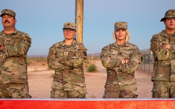 278th Soldiers paint mural on jersey barrier