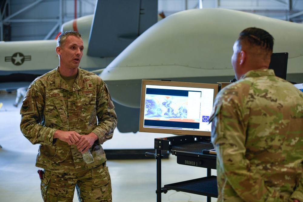 California ANG Command Chief Visits 163d Attack Wing, Coins Airman for Excellence