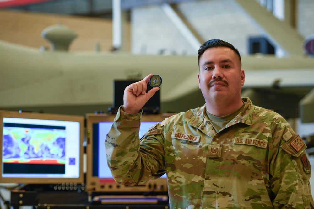 California ANG Command Chief Visits 163d Attack Wing, Coins Airman for Excellence