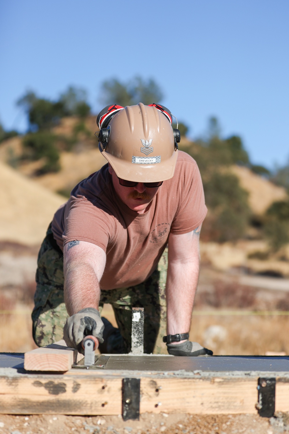 NMCB 4 Seabees Place Concrete for Ft. Hunter Liggett Pistol Qualification Range