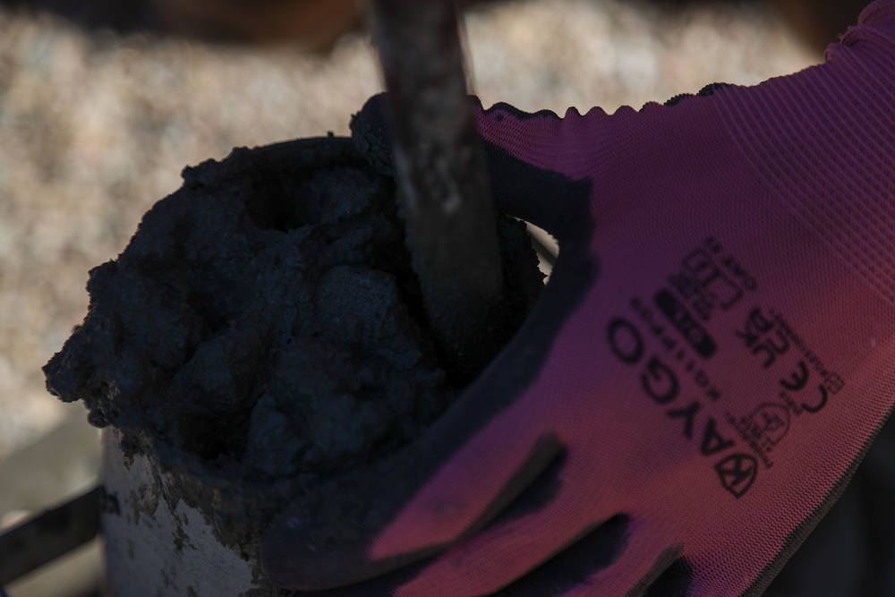 NMCB 4 Seabees Place Concrete for Ft. Hunter Liggett Pistol Qualification Range