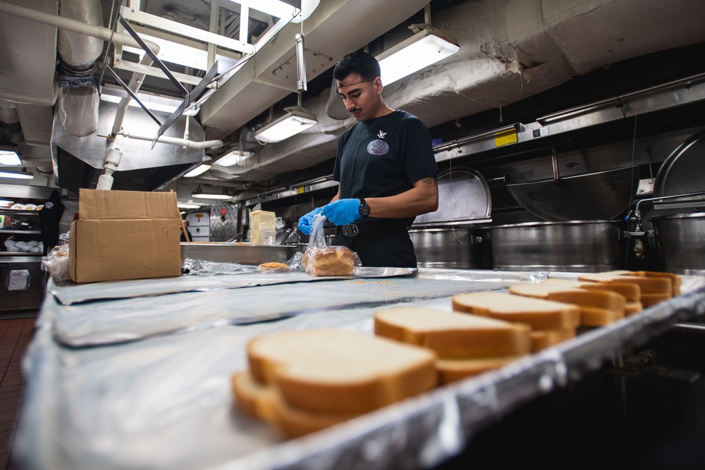 USS Ronald Reagan (CVN 76) Sailors serve lunch