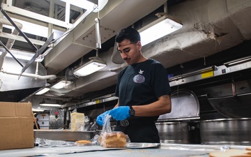 USS Ronald Reagan (CVN 76) Sailors serve lunch