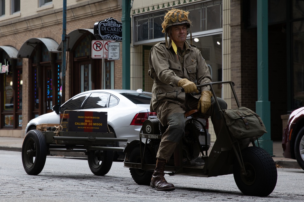 A member from the Midwest Military Vehicle Association participates in the Milwaukee Veterans Day Parade