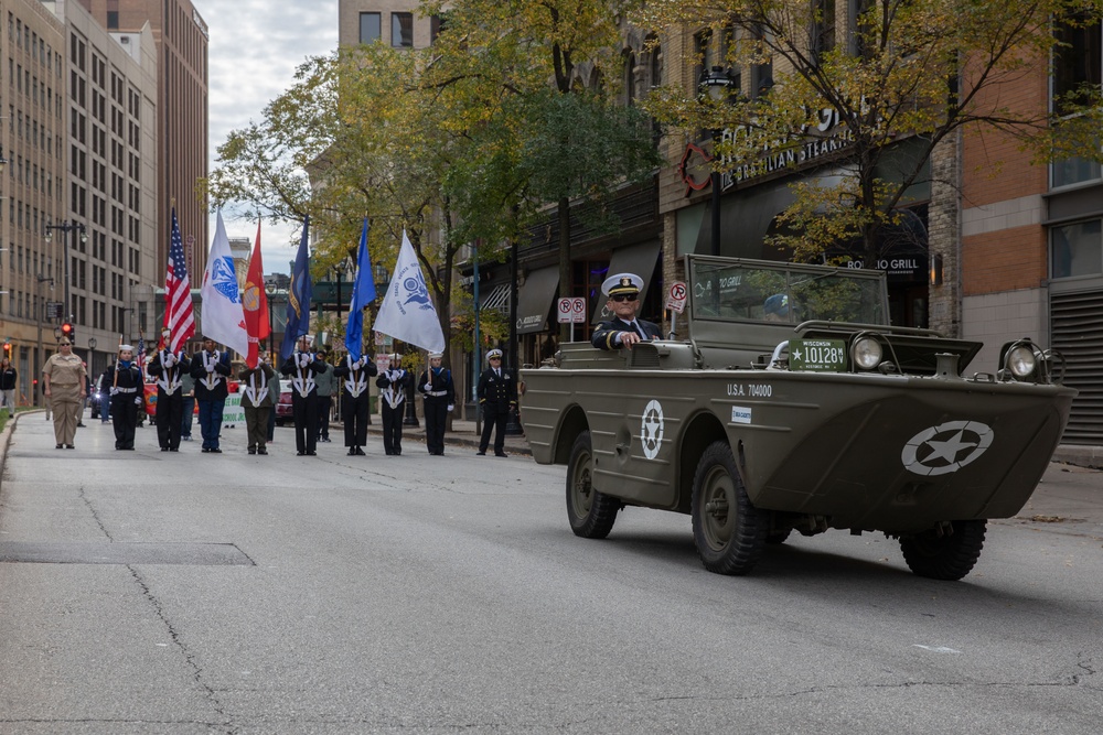 A member of the U.S. Navy Cruiser Division participates in the Milwaukee Veterans Day Parade